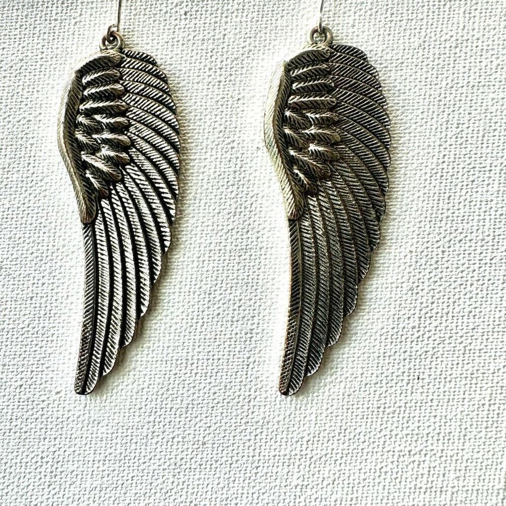 Silver tone angel wing earrings